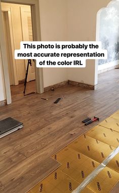 an image of a room being remodeled with wood flooring on the ground and walls