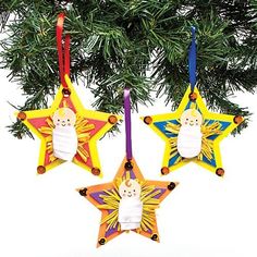 three christmas ornaments hanging from a tree