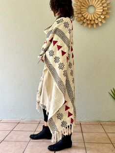 100% handwoven and hand-block printed cotton poncho with white large hood from textured cotton jersey. It is great for the wanderers, nomads and free spirits. It works perfect as a cover up, a throw or a large scarf. It is warm and soft, and will be a great addition to any wardrobe! This beautiful textured handwoven cotton has a nice and soft touch. Black and white hand-block print resembles the tribal print of the African mud cloth. The fabric was hand printed by the local artisans near Jaipur, Bohemian Cotton Handloom Shawl, Bohemian Cotton Shawl With Woven Motifs, Bohemian Cotton Poncho With Long Sleeves, Cotton Bohemian Poncho With Sleeves, Oversized Cotton Bohemian Poncho, Bohemian Long Sleeve Cotton Poncho, Handwoven Cotton Bohemian Shawl, Cotton Shawl Poncho For Festivals, Bohemian Cotton Shawl Poncho