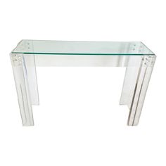 an acrylic console table with clear glass top and three thin lines on each side