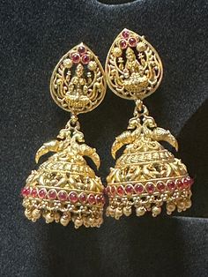 Elegant Antique finish Lakshmi jhumkas with push back stud to add more beauty to your traditional attire Please message, if you have any questions Note: Picture taken in natural light, so please allow some color variations due to screen resolution  Care Instruction : Avoid Heat & Chemicals Like Perfume, Deo, Alchol, Etc. | Clean With Dry Cotton Cloth Traditional Heavy Jhumkas For Festive Occasions, Red Earrings For Diwali Rituals, Temple Jewelry Jhumkas With Latkans As Gift, Festive Jhumkas With Intricate Design For Rituals, Temple Jewelry Style Danglers With Latkans For Ceremonial Use, Festive Traditional Round Jhumkas, Ceremonial Temple Jewelry Danglers For Festivals, Round Temple Jewelry Jhumkas For Ceremonial Occasions, Temple Jewelry Tilla Earrings For Puja