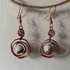 Handmade wire wrapped spiral earrings with coloured bead, perfect for any outfit or occasion. Please message me on instagram @georgeelizabethart if you would like to purchase without added fees :) Spiral Earrings, Handmade Wire Wrapped, Handmade Wire, Wire Jewelry, Wire Wrapped, Wire Wrapping, Jewelry Earrings Dangle, Dangle Drop Earrings, United Kingdom