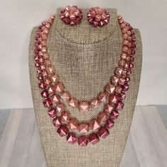 Vintage 1950s-1960s Three Strand Necklace And Clip On Earrings. Pyramid Studded Shaped In Shades Of Pink Pearl. Necklace Is 18" Inches In Length Including Extender. This Is A True Vintage Item. It Is Preowned And Not In New Or Unused Condition. Other Details: Please See Photos For All Details. All Items Come From A Smoke Free Home. Items Will Be Wrapped In White Tissue And Most Shipped In New Boxes, Their Original Box, Or Mailers But I Will Recycle When I Can. Packing Slips Will Not Be Included Retro Beaded Evening Jewelry, Retro Beaded Jewelry For Evening, Retro Beaded Jewelry For Party, Retro Beaded Party Jewelry, Retro Pink Jewelry For Formal Occasions, Pink Retro Style Jewelry For Formal Occasions, Retro Round Beads Jewelry For Party, Retro Round Bead Jewelry For Parties, Retro Evening Jewelry With Matching Earrings