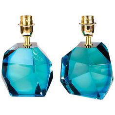 pair of blue glass perfume bottles with gold accents