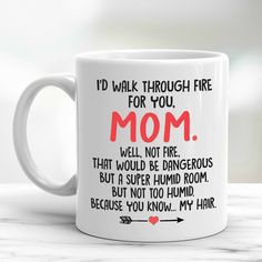 a coffee mug that says i'd walk through fire for you mom