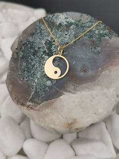 "Yin Yang necklace, ying yang charm, Solid Gold 14k, dainty necklace, delicate necklace, yin yang jewelry, gold coin necklace, disc pendant ♥ Material of pendant and chain: Solid Gold 14k ♥ Packaging: All of our jewelry is beautifully boxed and ready for gifting For more personalized designs take a look here: ♥ www.etsy.com/listing/631444472 ♥ www.etsy.com/listing/645292671 ♥ www.etsy.com/listing/645282627 ♥ www.etsy.com/listing/645285037 ♥ www.etsy.com/listing/645278199 ♥ www.etsy.com/listing/6 Minimalist Round Jewelry For Meditation, 14k Gold Spiritual Coin Necklace With Round Pendant, Symbolic Round Charm Necklace With Coin Pendant, Symbolic Round Charm Necklaces Tarnish Resistant, Symbolic Round Charm Necklace Tarnish Resistant, 14k Gold Circle Necklace With Coin Pendant, 14k Gold Circular Coin Pendant Necklace, Symbolic Round Tarnish-resistant Charm Necklaces, Symbolic Round Necklace With Moon Charm