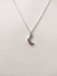 ◆ Necklace with small half moon plated in silver this necklace is very simple and elegant and has an adjustable silver chain the moon size is only 0,629921 inches! ♡ In my shop there are many handmade jewelry for all tastes, come and watch them you are welcome! ♡ Minimalist Half Moon Necklace With Adjustable Chain, Minimalist Half Moon Clavicle Chain Necklace, Dainty Crescent White Gold Necklace, Minimalist Jewelry With Adjustable Half Moon Chain, Elegant Sterling Silver Crescent Charm Necklace, Minimalist Half Moon Phase Necklace, Nickel Free Sterling Silver Crescent Necklace, Nickel Free Half Moon Silver Necklace, Adjustable Half Moon Sterling Silver Jewelry