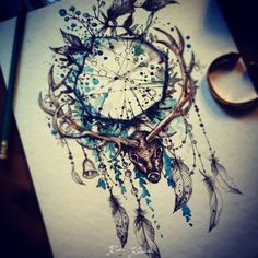 a drawing of a deer's head with feathers and dream catchers on it