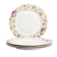 three plates with floral designs on them, one is white and the other has pink flowers