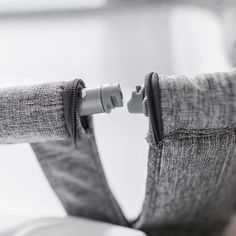 the back end of a chair with zippers on it's arms and legs