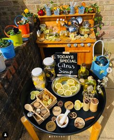 a table topped with lots of different types of food on top of a black tray