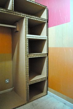 an empty closet is shown with shelves on the wall