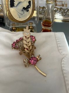 Classy Pink Rhinestone Bouquet Brooch from Grandma's estate. Embellished with Gold Tone Greenery. All stones in tact. Victorian Pink Brooches For Wedding, Flower Shaped Costume Jewelry Brooches For Wedding, Vintage Pink Brooches For Evening, Pink Vintage Brooches For Evening, Vintage Pink Evening Brooches, Pink Vintage Evening Brooches, Rhinestone Bouquet, Bouquet Brooch, Brooch Bouquets