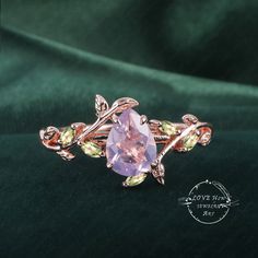 Art Deco Pear Lavender Amethyst engagement ring Bridal  Rose Gold Unique Leaf Nature Inspired  Gemstone Promise Cluster ring jewelry Gift (Please comfirm your US size when you make an order) Jewelry details: Matal Type: 14k gold /18k gold Engagement Ring: Center Stone: Lavender Amethyst Stone Size: 6*8mm Side stones: peridot Total weight: 0.18ctw (High Quality) Wedding band Moss Agate and moissanite Carat Weight: approx. 0.182ctw Or: black sapphire (If you choose side stone in black sapphire) Purchase Guarantee: 1: Provide you with the best service. 2: 14 Day Refund Guarantee. 3: Free Gift Box&Packing 4: Free Shipping and insurance to All Parts Of The World. Accessories: beautiful Ring box, and little gifts. Processing time: When we receive payment We need 2-3 weeks to work for your items Exquisite Amethyst Ring For Wedding, Purple Amethyst Ring With Rose Cut Diamonds For Wedding, Purple Rose Cut Diamond Jewelry For Wedding, Rose Cut Amethyst Jewelry For Wedding, Lavender Gemstone Jewelry For Promise, Gift Jewelry With Rose Cut Diamonds And Amethyst, Purple Sapphire Ring With Rose Cut Diamonds As Gift, Gift Purple Sapphire Ring With Rose Cut Diamonds, Kunzite Wedding Jewelry With Center Stone