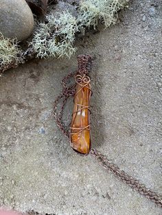 "A piece of carnelian I found along the bank of the Willamette River here in Oregon. I love Carnelian, and this is a pretty one. I wire wrapped/weaved it using 99.9% pure copper wires and then oxidized them to give a more antiqued look. The chain is copper plated. The chain is about 20.5\"long- if you would like it shorter just message me. The pendant is a bit over 3\"long from top of bale to bottom of weave. HANDMADE WITH LOVE.  Each color, type of stone or material and design are thoughtfully Brown Wire-wrapped Carnelian Jewelry, Brown Wire Wrapped Carnelian Jewelry, Wire Wrapped Brown Carnelian Jewelry, Unique Wire Wrapped Copper Crystal Necklaces, Unique Copper Wire Wrapped Crystal Necklaces, Amber Artisan Wire Wrapped Necklace, Artisan Wire Wrapped Amber Necklace, Artisan Amber Wire Wrapped Necklace, Bohemian Copper Wire Wrapped Crystal Necklaces