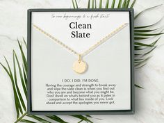 the clean slate necklace is displayed in its box