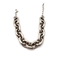 "Make every outfit a stunner with this vintage jumbo Kenneth Jay Lane cable chain silver plated necklace. The necklace adjusts from 16\" - 18\" and fits snugly around your throat. A wonderful designer necklace to add to your collection! Kenneth Jay Lane began his work in 1963 after he graduated from the Rhode Island School of Design. He studied under Hattie Carnegie and began his work designing shoes for Christian Dior. He skyrocketed into the costume jewelry industry when designing pieces for E Chunky Metal Oval Link Necklace, Silver Chunky Metal Chain Necklace, Silver Chunky Chain Link Necklaces, Chunky Oval Link Metal Chain Necklace, Chunky Metal Chain Necklace With Oval Links, Silver Chunky Link Chain Necklace, Classic Silver Jewelry With Chain Strap, Silver Jewelry With Oval Link Chain Strap, Elegant Silver Chunky Necklace