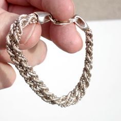 Wonderful double-stranded sterling silver bracelet - the links are twisted into a spiral. Stamped Milor, 925 and Italy. Measures 7 1/2 inches long. Width (both strands together) is 3/8 of an inch. Circa 1980. Sturdy construction with a large lobster claw clasp that closes securely. Weight is 16.4 grams or .58 oz. Excellent vintage condition with minor surface wear and some patina. Elegant Silver Braided Bracelet With Lobster Clasp, Classic Silver Twisted Jewelry, Silver Rope Chain Jewelry For Everyday, Classic Twisted Silver Jewelry, Everyday Silver Rope Chain Jewelry, Elegant Sterling Silver Braided Bracelets With Silver Chain, Modern Twist Sterling Silver Bracelets, Modern Silver Sterling Silver Bracelet, Modern Sterling Silver Bracelets