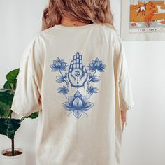 Elevate your style and inner peace with our enchanting Indigo Om tee. This understated yet deeply meaningful design will have you emanating tranquility wherever you go. Perfect for yogis, meditators, and seekers of enlightenment on their journey to awakening. 👕 This Comfort Colors C1717 garment-dyed t-shirt is made with 100% ring-spun cotton that is ethically grown and harvested. The relaxed fit and pre-shrunk fabric ensures a consistently great fit that has made this shirt one of the most popu White Crew Neck Top For Meditation, White Spiritual Graphic T-shirt, Cotton Relaxed Fit Top For Meditation, Relaxed Fit Graphic Print Tops For Meditation, Casual Graphic Print T-shirt For Meditation, White Graphic Print T-shirt For Yoga, Lotus Flower Spiritual, Meaningful Design, Spiritual Yoga