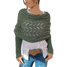 a woman wearing a green knitted shawl with holes in the middle and a white t - shirt underneath