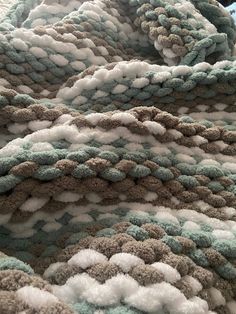 a close up view of a blanket made with yarn