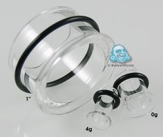 an assortment of different sizes and shapes of clear glass objects with black rubber rings around them