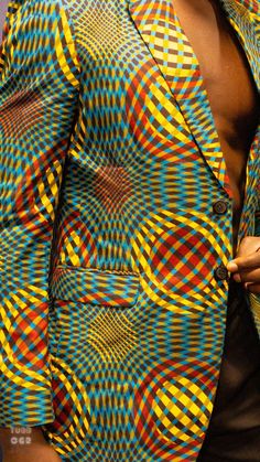 PRODUCT DETAILS: Designed in the U.S., hand-crafted in Africa Delivery within 2 weeks Print shown in Green, Yellow, Wine, Blue, White and Brown. This classic blazer provides a new look with colorful African Ankara print! Can be customized and tailored to any body type and shape and can be worn for multiple occasions, including as formal and evening wear. CUSTOM: You pick your fabric and style @ Custom Clothes. FABRIC CARE: Dry Clean. SIZE CHART: Fitted Notch Lapel Printed Blazer, Fitted Notch Lapel Blazer With Printed Details, Fitted Notch Lapel Blazer With Print, Multicolor Printed Blazer For Work, Multicolor Fitted Notch Lapel Blazer, Tailored Multicolor Formal Blazer, Multicolor Notch Lapel Blazer For Formal Occasions, Printed Blazer For Men, African Print Blazer