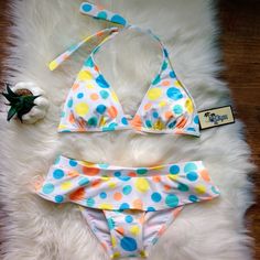 Brand New Size Smallo2gym Polkadotted Bikini Top And Bottom Precious Bikini Set! White With Blue, Yellow, And Orange Polka Dots. Top Ties At Neck And Back, Bottom Is Skirted At The Hips So It's Super Flattering. Never Worn, Still Has Hygienic Lining On The Bottoms. Both Top (Retail $38) And Bottoms (Retail $32) Are Size Small And Are Lined. Get Both For Less Than The Price Of One! :) 82% Nylon, 18% Spandex Measurements: Waist: 16" (Has Some Stretch) Playful Fitted Tankini For Beach Party, Polka Dot Fitted Swimwear, Fitted Polka Dot Swimwear, Fitted Polka Dot Beachwear Swimwear, Retro Fitted Polka Dot Swimwear, Playful Fitted Bottoms For Beach Season, Fitted Playful Beach Season Bottoms, Polka Dot Fitted Tankini For Poolside, Poolside Fitted Polka Dot Tankini