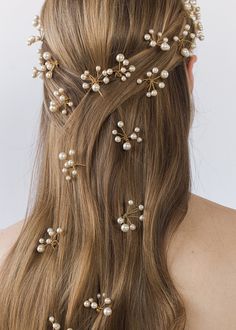 The Primavera Hair Pins were inspired by the ethereal essence of a Botticelli painting. Each pin in this set of three is comprised of numerous Swarovski pearls, which are meticulously strung by hand in our Brooklyn studio, creating a diaphanous spray of pearls with the illusion they're floating in midair. Consider pairing with the matching Primavera Circlet, or mixing with the Perla Bobby Pins. Packaging Dimensions: 6.5 x 6.5 x 1.75 inches Weight: Pins Packaging, Pearls In Hair, Rose Knight, Hair Pearls, Bridesmaid Hair Inspo, Pearl Hair Pin, Pearl Hair Pin Wedding, Ethereal Essence, Beaded Hair Pins