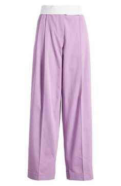 These cotton-gabardine pants in a gorgeous lilac hue feature tailored pleats and tapered legs that end at cuffed hems. 31" inseam; 16" leg opening; 13" front rise; 15 1/2" back rise (size 36) Zip fly with hook-and-bar closure Side-seam pockets 100% cotton Dry clean Made in Turkey Purple Wide Leg Work Pants, Purple Wide Leg Workwear Pants, Wide Leg Purple Workwear Pants, Purple Wide-leg Workwear Pants, Purple Wide-leg Pants For Work, Elegant Purple Bottoms For Workwear, Purple Tapered Leg Bottoms For Spring, Chic Pleated Purple Bottoms, Purple Pleated Bottoms For Spring