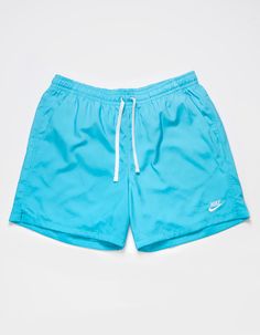 Nike Essentials Flow Nylon Shorts. Elastic Drawstring Waist. Nike Logo Embroidered At Hem. Slant Hand Pockets. Back Patch Pocket. Mesh Lined Interior. Approx. Inseam: 5.5''. 100% Polyester. Machine Wash. Imported. Nike Sporty Bottoms For Poolside, Nike Bottoms For Swimming And Beach Season, Nike Swimming Bottoms For Beach Season, Nike Swimming Bottoms For Beach, Nike Swim Bottoms For Beach Season, Nike Nylon Beach Bottoms, Nike Sports Swim Shorts, Nike Sporty Swimwear For Summer, Nike Casual Swimwear For Beach Season