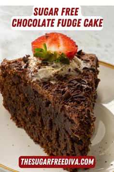 a slice of chocolate fudge cake on a plate with strawberries and whipped cream