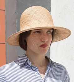 "Pine" is a feathery summer sun hat with a wide flared brim. The shapely curve of the brim ensures a perfect fit and underlines a clear, feminine look. The material "Bao" made of the undyed fibres of the baobab tree is pleasantly permeable to air and ensures maximum wearing comfort. A hoop integrated into the edge of the hat provides additional stability. Available in sizes 55 cm - 60 cm. Colour "nature" Hat of "Bao" - Monkey bread tree  Grosgrain ribbon (inside) made of 66% cotton and 34% polya Elegant Boater Hat For Vacation, Elegant Natural Panama Hat, Elegant Natural Boater Hat For Garden Party, Curved Brim Sun Hat For Summer, Handmade Straw Hat For Summer Garden Party, Chic Straw Sun Hat For Garden Party, Handmade Straw Hat For Garden Party In Summer, Elegant Natural Panama Hat With Curved Brim, Elegant Natural Brimmed Panama Hat