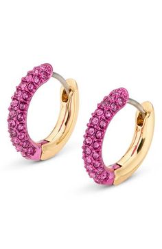 Shimmering faceted crystals add rich sparkle to these huggie earrings that are finished in a warm golden hue. 12mm hoop diameter; 2.5mm width Hinge with snap-post closure Goldtone plate/crystal Imported Pink Jewelry, Kurt Geiger, Huggie Hoop Earrings, Faceted Crystal, Huggies Earrings, Gold Tones, Sparkle, Hoop Earrings, Nordstrom