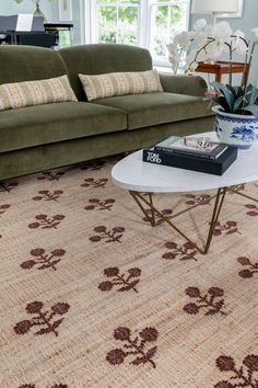 a living room filled with furniture and a rug