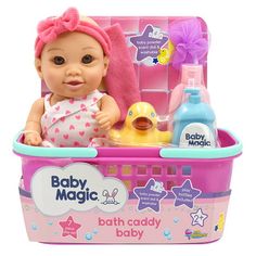 a baby doll in a bath caddy with toys