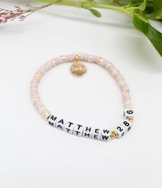 Our classic 'cocktail mix' of Easter colors! Customize this bracelet with your favorite verse. Materials: Our 'cocktail' mix of mini cream, lavender, and gold heishi beads with our white square + black letter beads. Complete with an Onie + Sky charm! Shipping Note: This custom item takes 3-5 days to produce and is not eligible for expedited shipping. We aim to try and have items in your hands within 10 business days! Final Sale: This item is final sale and not eligible for returns. Please double Bible Verse Bracelet, Christian Bracelets, Morse Code Bracelet, Cocktail Mix, Easter Colors, Black Letter, Letter Beads, Christian Jewelry, Heishi Beads