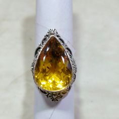 "Citrine Ring Women, Sterling Silver Ring, Citrine Gemstone, Sterling Silver Ring, Handmade Teardrop Shape, Size 15x22 MM Stone Size = 15x22 MM Stone Shape = Teardrop  Weight in Grams = 19.82 gm (approx) About Citrine => You Need Citrine If... Are you looking for the light at the end of the tunnel? Are you in search of a crystal to uplift your spirit and bring more positivity and happiness into your life? Are you working on attracting wealth and success, but need a boost of confidence to go afte Yellow Gemstone Pear-shaped Ring, Yellow Pear-shaped Gemstone Ring, Sterling Silver Teardrop Topaz Ring, Teardrop Topaz Ring Gift, Teardrop Topaz Ring For Gift, Teardrop Topaz Ring For Anniversary, Yellow Teardrop Rings For Anniversary, Yellow Pear-shaped Gemstone Jewelry, Unique Yellow Teardrop Jewelry