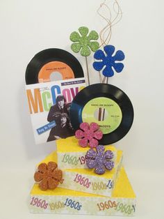 an assortment of records and flowers are on display