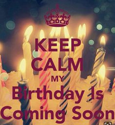 a birthday cake with lit candles and the words keep calm my birthday is coming soon