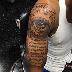 a man with a clock and eye tattoo on his arm