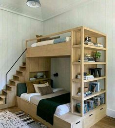 there is a bunk bed with stairs in the room