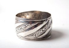 A fine, weighty  high grade silver bracelet from the Anti Atlas region in Morocco. Height 4 cms, diameter 6.5 cms Weight 93 grams Would fit over a medium to large hand. Beautifully worn. It was once a lady's dowry or savings.