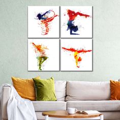 three abstract paintings on the wall above a couch in a living room with a coffee table