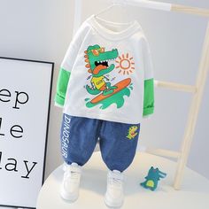 Baby Boy Splicing Cartoon Surfing little Dinosaur Sets Boys Casual Suitoy - PrettyKid White Cotton Sets With Patchwork, Green Cotton Sets With Character Print, White Patchwork Sets For Summer, White Character Print Summer Sets, White Patchwork Summer Sets, White Character Print Sets For Summer, Casual Green Dinosaur Print Sets, Casual Green Sets With Dinosaur Print, White Long Sleeve Patchwork Sets