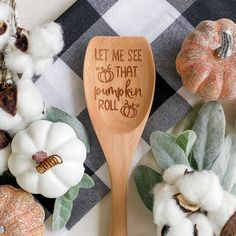 a wooden spoon that says let me see the pumpkin roll