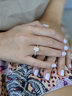 a woman's hand with a ring on it