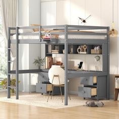 a loft bed with desk underneath it in a child's room