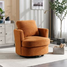 an orange swivel chair sitting on top of a white rug