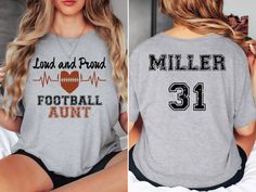 Please note: While we do our best to ensure timely delivery, shipping delays may occur due to weather, carrier issues, or high holiday demand. Unfortunately, we cannot guarantee arrival before Christmas. Thank you for your understanding! Cheer on your favorite player on game day with our personalized Football Aunt shirt! 📢 Please message us prior to ordering with any questions you may have. SIZING: * Tees are Unisex, classic fit. Please refer to the size chart in listing photos for details. * E Personalized Game Day Tops With Team Spirit, Personalized Crew Neck T-shirt For Game Day, Sporty Personalized T-shirt For Game Day, Personalized Sporty T-shirt For Game Day, Personalized Short Sleeve T-shirt For Game Day, Personalized Short Sleeve Tops For Game Day, Personalized Short Sleeve Tops For Sports Events, Football Aunt Shirts, Football Aunt